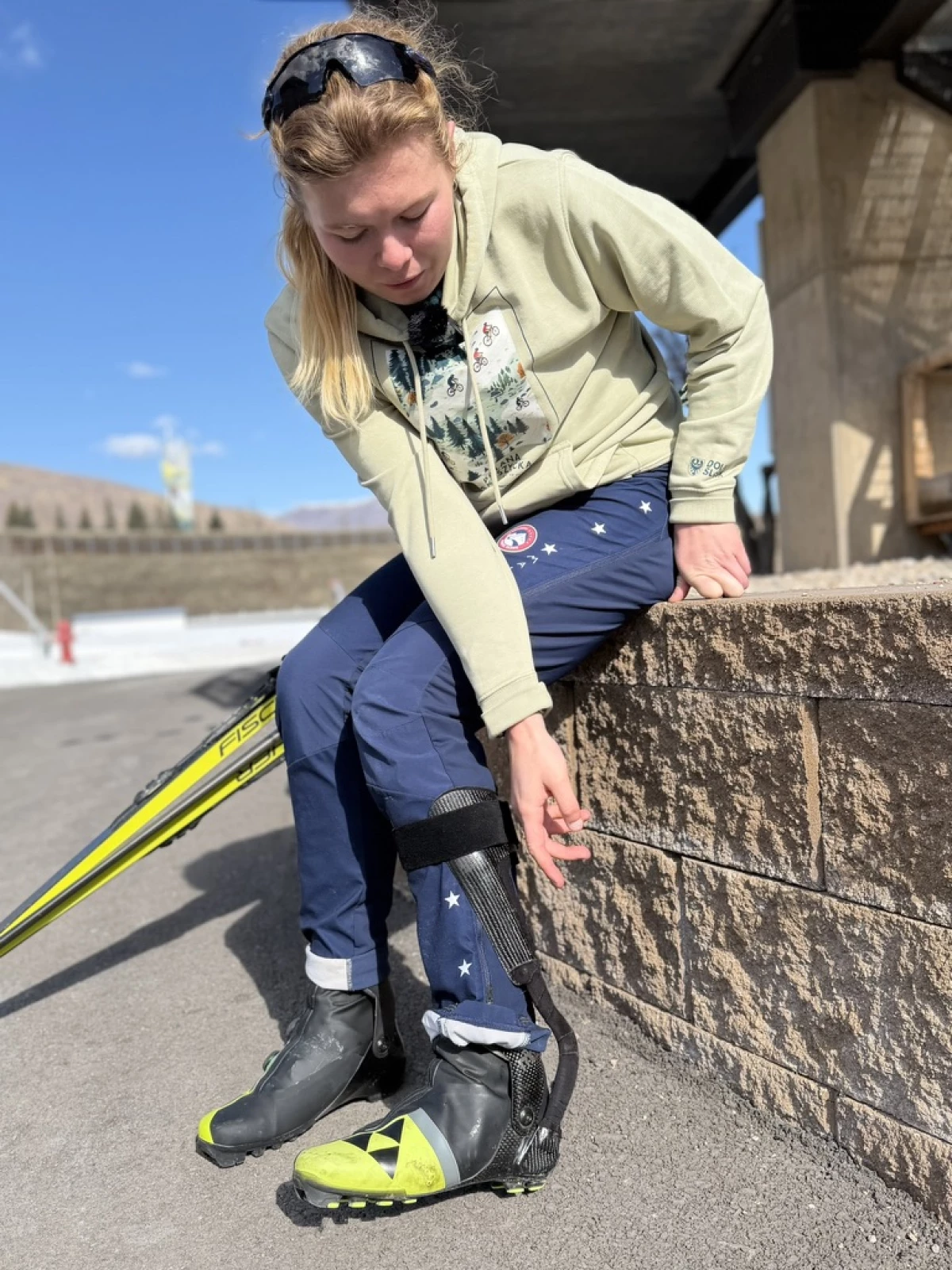 Paralympian Sydney Peterson shows an ankle brace she uses for skiing.