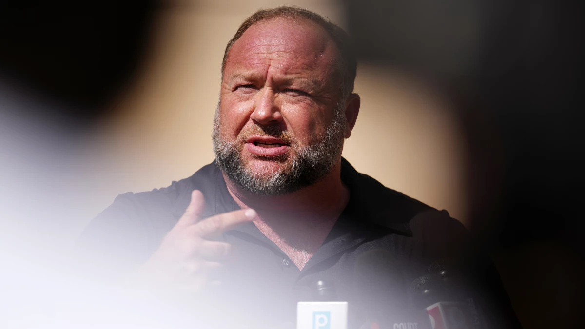 Infowars founder Alex Jones speaks to the media outside Waterbury Superior Court in Waterbury, Conn., on Sept. 21, 2022. Several victims' families successfully sued Jones for causing emotional and psychological harm after they lost their children in the 2012 Sandy Hook massacre.