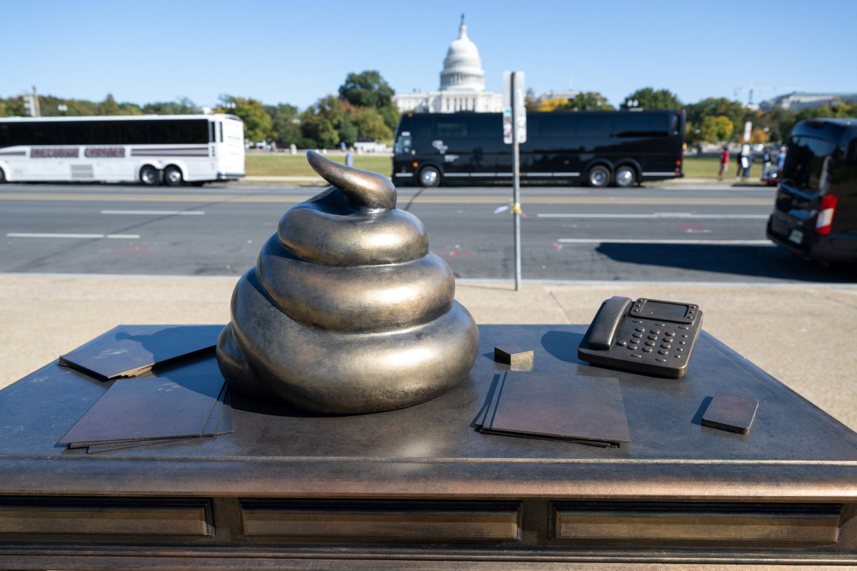 A temporary installation depicting a pile of feces on former House Speaker Nancy Pelosi's desk, in late October 2024, called out then-candidate Trump's defense of those who stormed the Capitol on Jan. 6, 2021.
