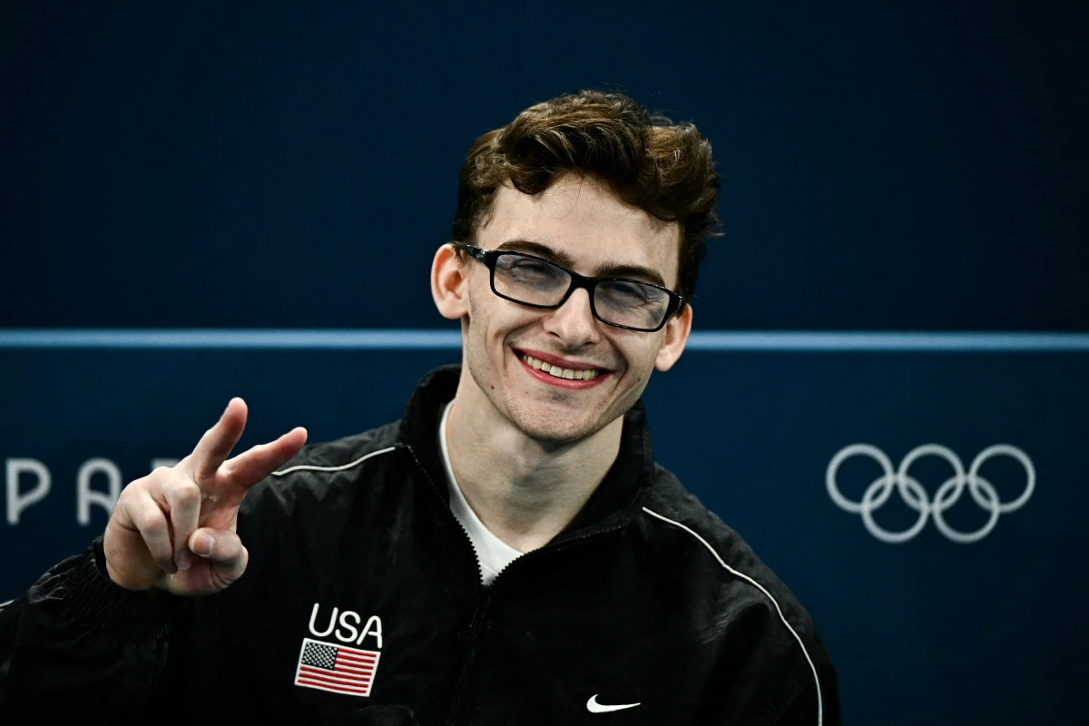 Stephen Nedoroscik throws a peace sign during the artistic gymnastics men's qualification at the Bercy Arena in Paris on Saturday.