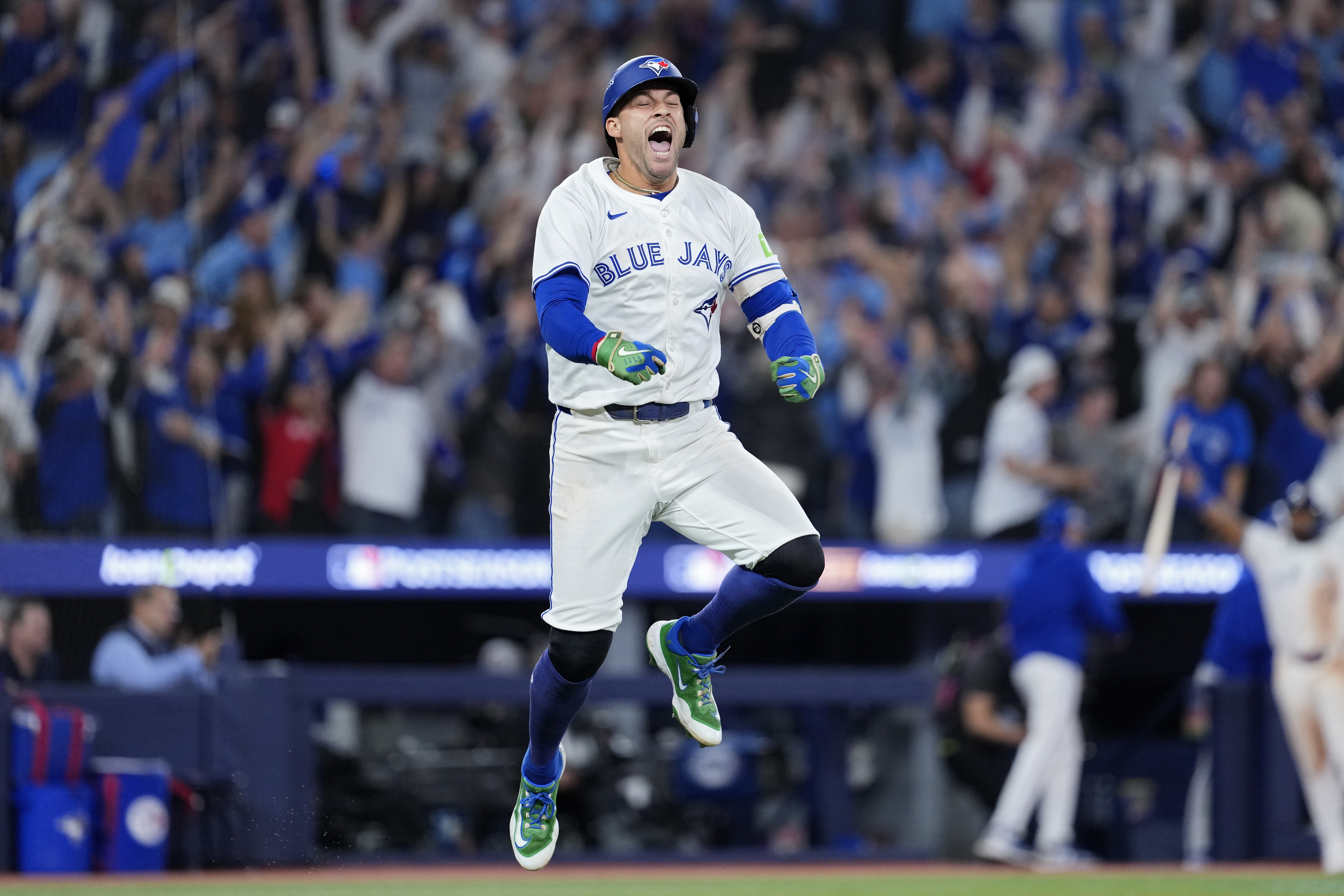 George Springer of the Toronto Blue Jays celebrates after hitting a three-run home run against the Seattle Mariners during the seventh inning in game seven of the American League Championship Series in Toronto.