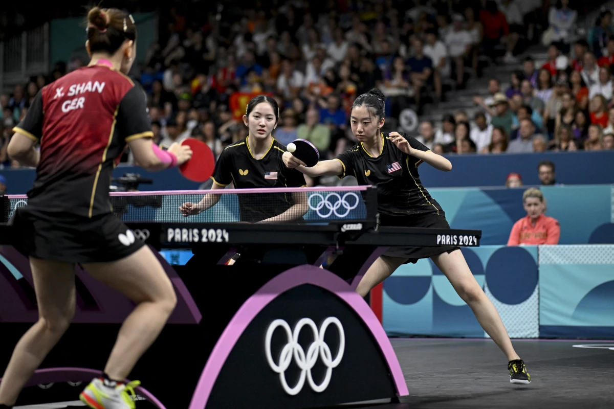 Rachel Sung and Amy Wang of the U.S. women's table tennis team take on Germany during the 2024 Olympic Games in Paris.