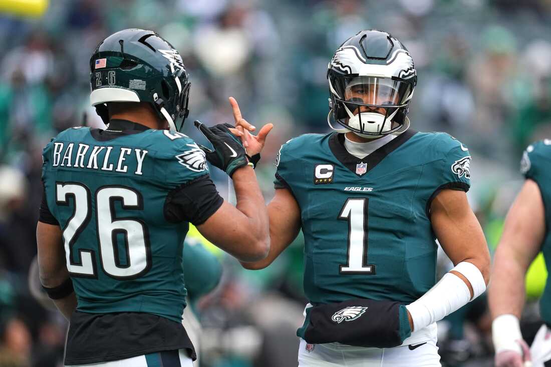 PHILADELPHIA, PENNSYLVANIA - JANUARY 26: Jalen Hurts #1 of the Philadelphia Eagles high fives teammate Saquon Barkley #26 prior to the NFC Championship Game against the Washington Commanders at Lincoln Financial Field on January 26, 2025 in Philadelphia, Pennsylvania. (Photo by Mitchell Leff/Getty Images)
