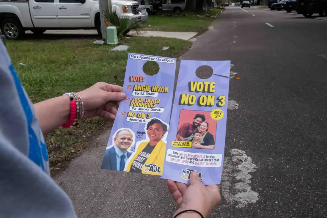 Florida Rising's cheatsheet door hangers have "Vote no on 3" on one side and "Vote Angie Nixon for U.S. Senate, Vote Jose Javier Rodriguez for Attorney General and Vote no on 3" on the other side.