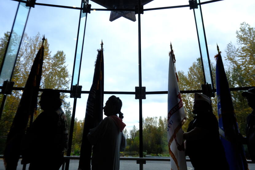 A procession of Alaska Native veterans carry the flags inside the the Alaska Native Heritage Center on Sept. 27, 2026.
