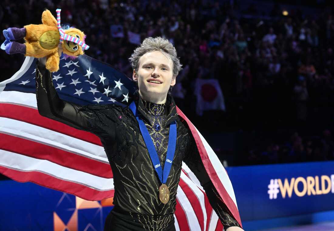Ilia Malinin celebrates after winning his third Figure Skating World Championships in Prague, Czech Republic on Saturday.