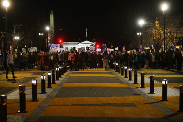 Under the motto "Light for Our Democracy," people gather at Black Lives Matter Plaza near the White House on March 4, 2025, to protest the Trump administration.