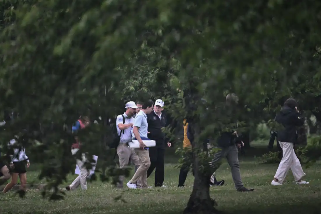 President Trump, seen touring the East Potomac Golf Links in late June.
