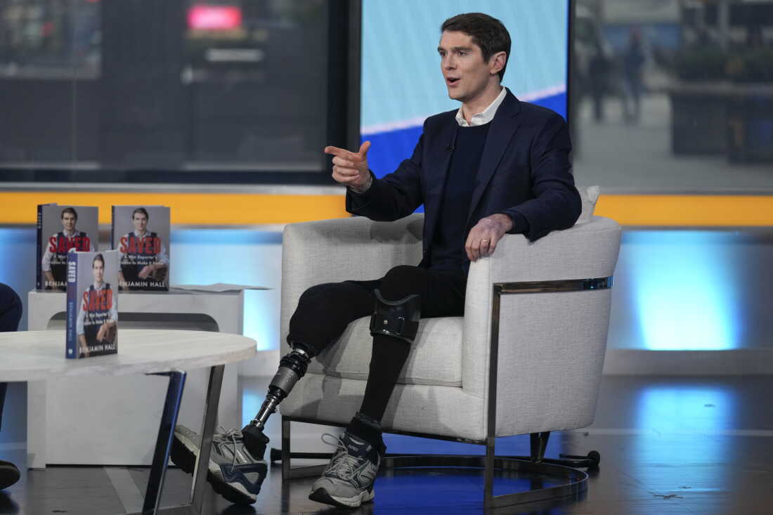  A War Reporter's Mission to Make It Home," on "Fox & Friends" on March 10, 2023. He has a metal prosthetic leg and a leg brace on his other leg.