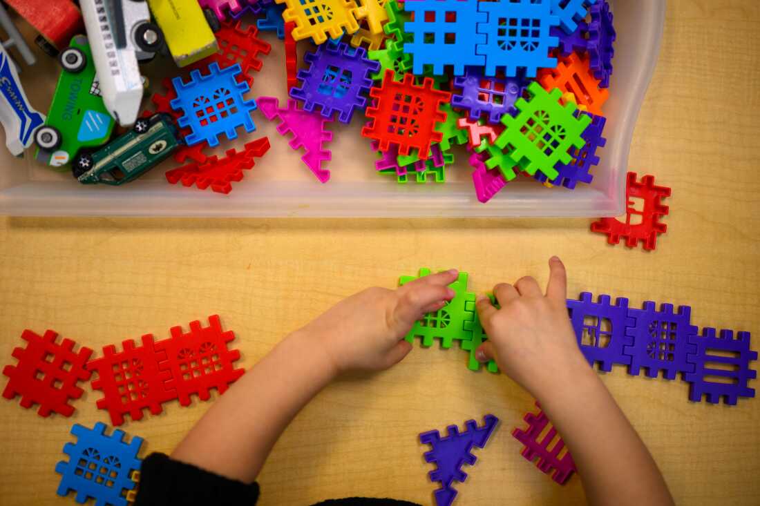 A student plays with interlocking toys at the Connecticut State University Early Learning Center in New Britain, Ct. on March 12, 2025.