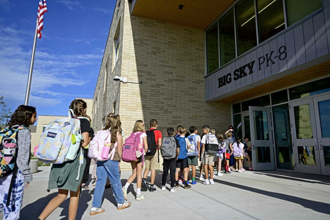 Students filter their way into the building during their first day of class at the Big Sky PK-8 School in Mead, Colo. on Aug. 18, 2026.