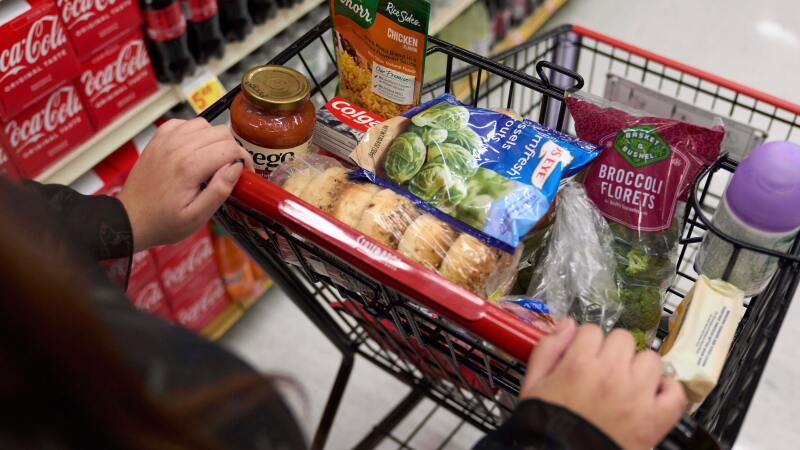 A California's SNAP benefits shopper pushes a cart through a supermarket in Bellflower, Calif., Feb. 13, 2023.