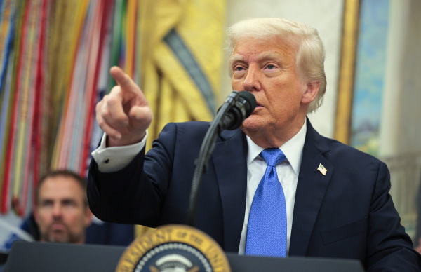 President Trump takes questions from reporters at an event in the Oval Office on May 19, 2025.