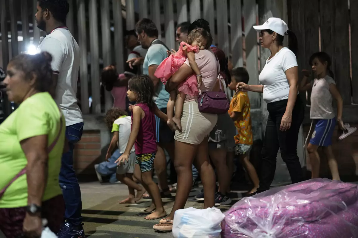 People displaced by violence in towns across the Catatumbo region, where rebels of the National Liberation Army, or ELN, have been clashing with former members of the Revolutionary Armed Forces of Colombia, arrive for shelter at a soccer stadium in Cúcuta, Colombia, on Sunday.