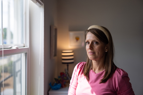 Amanda Whitworth stands by the window in her son's bedroom on July 18.