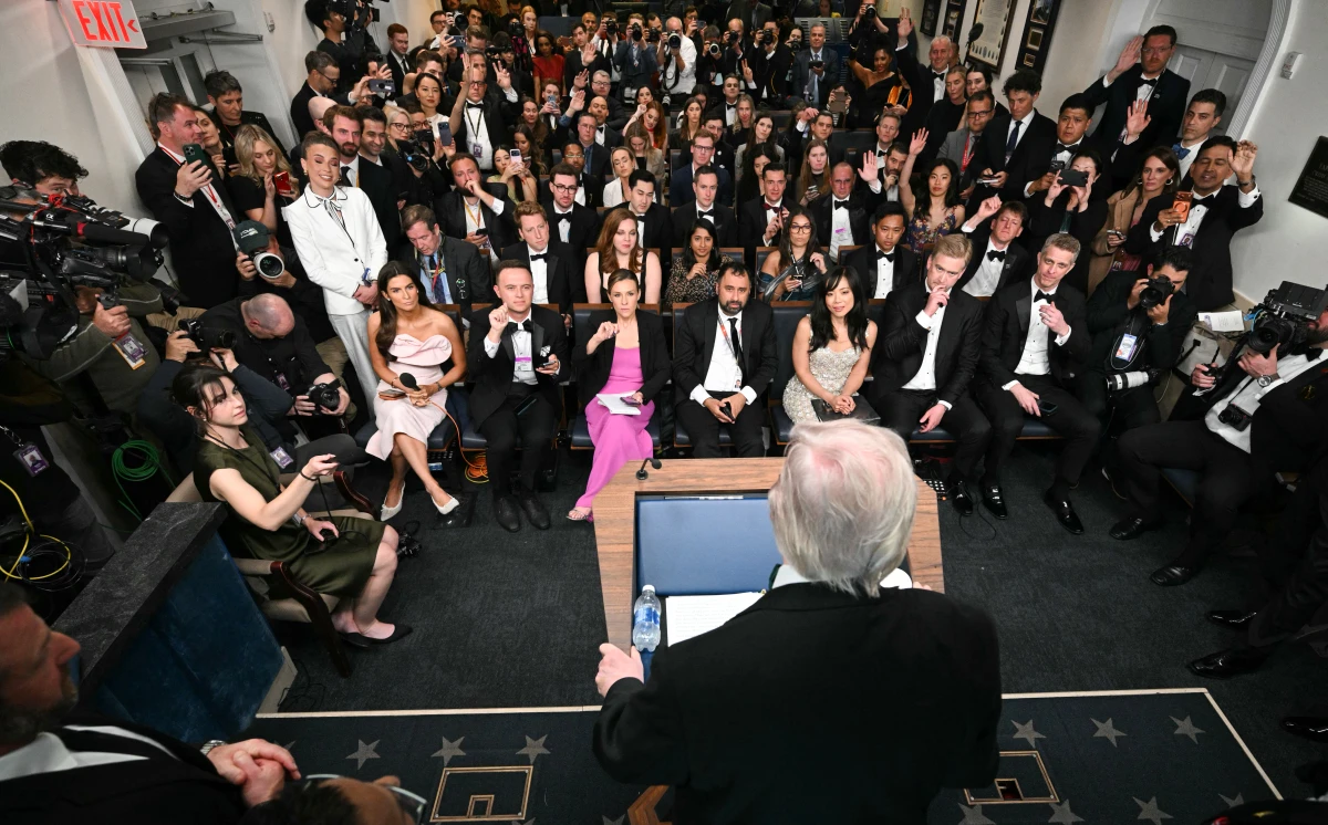 President Trump address journalists, still in their black-tie attire, in the Brady Briefing Room after the White House Correspondents' Association Dinner on Saturday night.