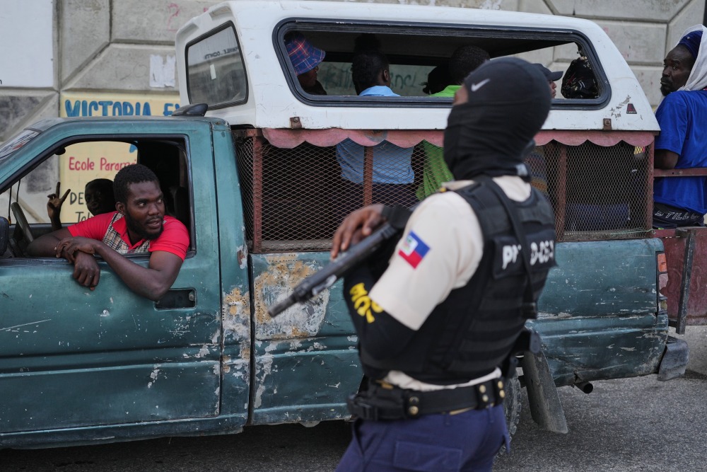 A police officer stands guard in Port-au-Prince, Haiti, Tuesday, March 3, 2026. (AP)