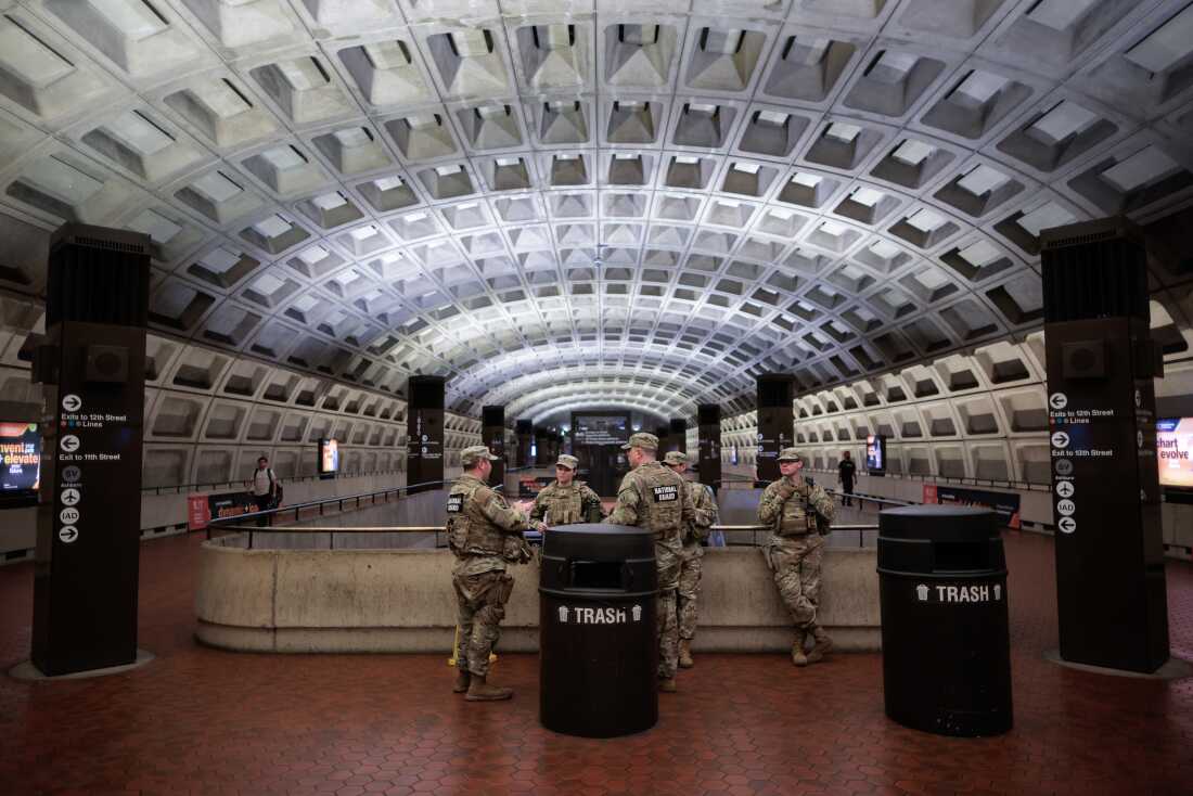 U.S. Army National Guard members stand inside the Metro Center subway station in the heart of downtown on May 16, 2026 in Washington, DC.