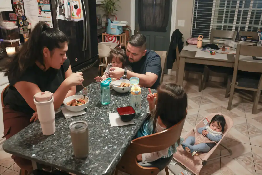 Karlo Campana at dinner with his wife Lily and their three children. His experience reflects a broader shift across California, where fathers accounted for 51% of paid bonding leave claims in 2025, surpassing mothers for the first time.