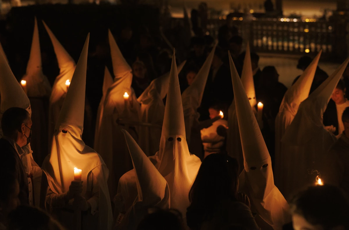 Penitents of La Paz brotherhood take part in a procession.