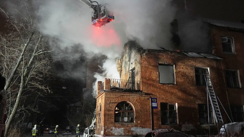 Rescue workers put out a fire at a residential building damaged by a Russian strike in Kyiv, Ukraine, Friday.