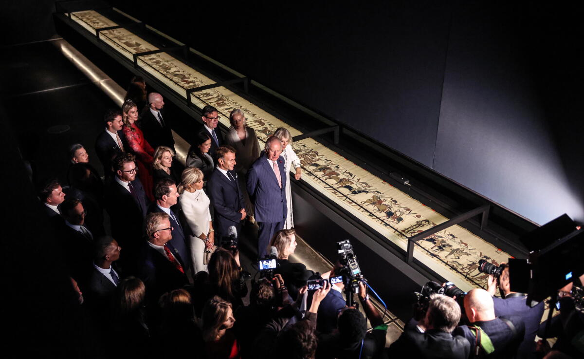 After 900 years, the Bayeux Tapestry returns to England and goes on display in London 2 King Charles III and Queen Camilla, accompanied by France's President Emmanuel Macron and his wife Brigitte Macron, British Prime Minister Andy Burnham and his wife Marie-France van Heel, view the Bayeux Tapestry exhibition at the British Museum on Sept. 2 in London.