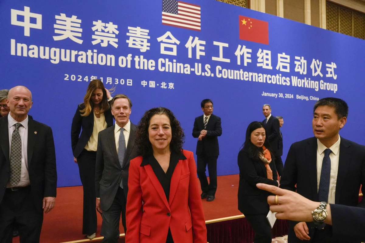 Jen Daskal (center), a deputy assistant to President Biden on the National Security Council who focuses on fentanyl policy, walks next to Xu Datong (right), director of China's Narcotic Control Bureau, after a launch ceremony of the U.S.-China Counternarcotics Working Group in Beijing on Jan. 30.