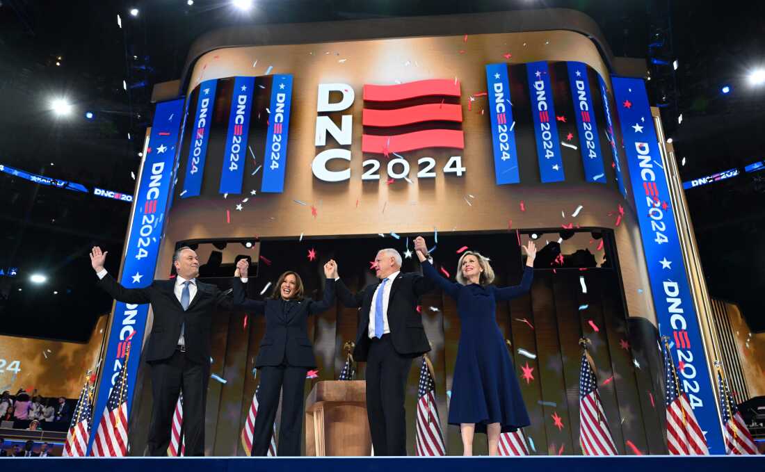 In this file photo, former second gentleman Douglas Emhoff, former Vice President and 2024 Democratic presidential candidate Kamala Harris Minnesota Governor and 2024 Democratic vice presidential candidate Tim Walz and Tim Walz's wife Gwen Walz hold hands at the end of the fourth and last day of the Democratic National Convention (DNC) in Chicago, Illinois, on August 22, 2024.