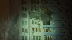 A residential building is damaged after a Russian air strike during a heavy snow storm in Kyiv, Ukraine, early Friday, Jan. 9, 2026.