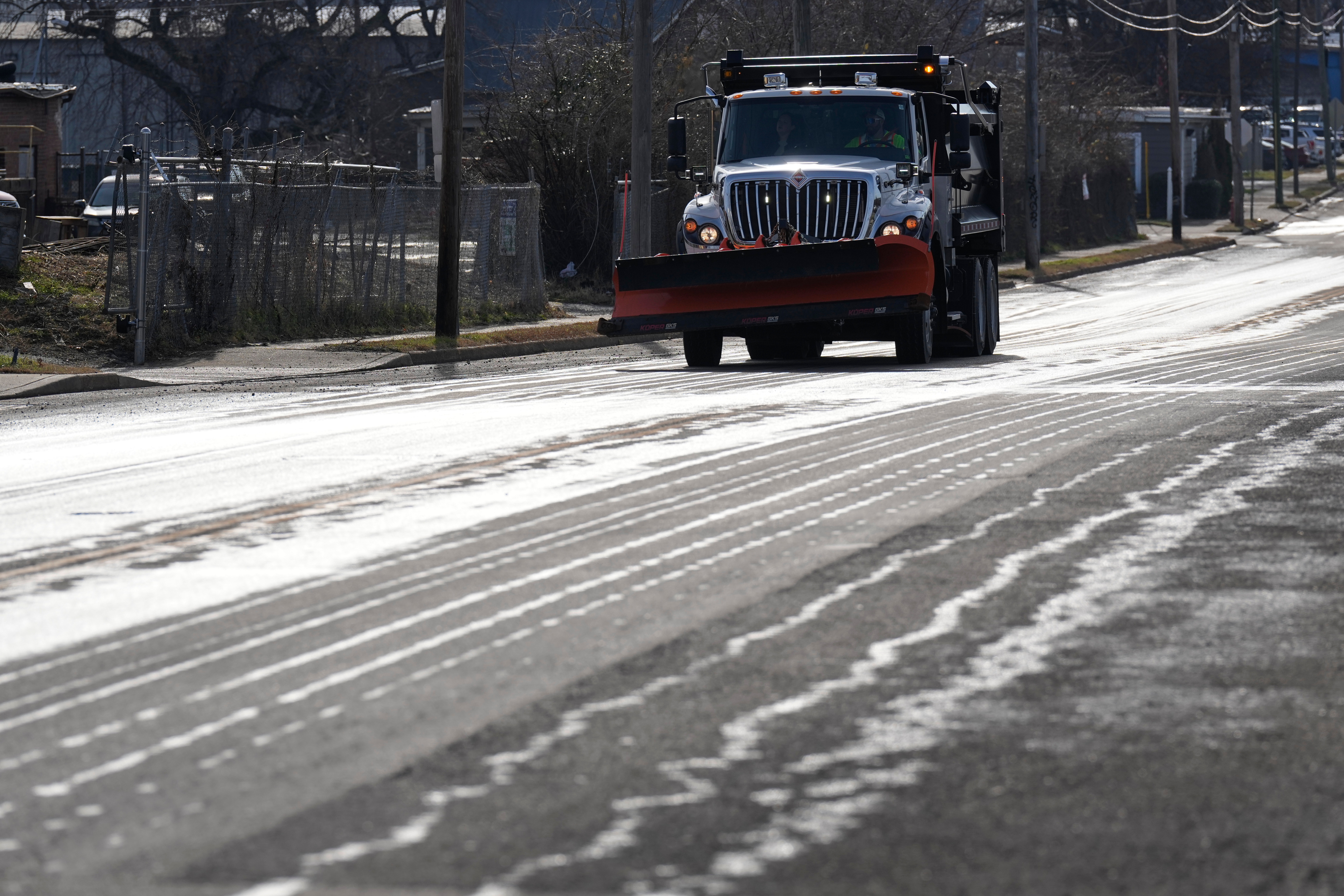 A Nashville Department of Transportation truck applies salt brine to a roadway Thursday, Jan. 22, 2026, in Nashville, Tenn. ahead of a winter storm expected to hit the central and eastern United States over the weekend.