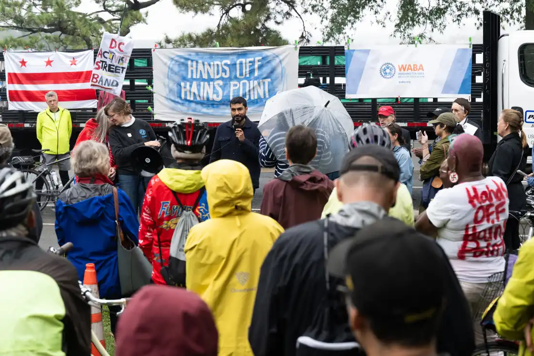 Locals rally against Trump's potential redevelopment of East Potomac Park at a protest in early October. Runners, cyclists, birders and more worry they will lose access to the space under Trump's plan to overhaul the municipal golf course there will
