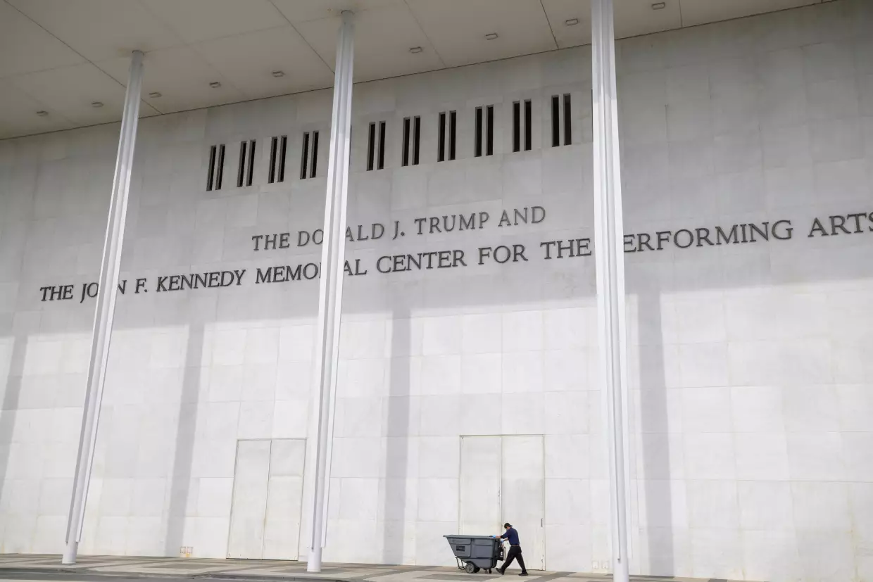 A man wheels a garbage bin outside of The John. F. Kennedy Center for the Performing Arts, Saturday, June 6, 2026, in Washington.