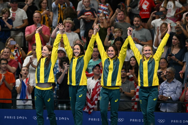 Team Australia's Mollie O'Callaghan, Lani Pallister, Brianna Throssell and Ariarne Titmus celebrate after the women's 4x200m freestyle relay swimming event. Swimmers have said the Paris Olympics pool is the same for everyone — and that the arena has been an exciting place to swim.