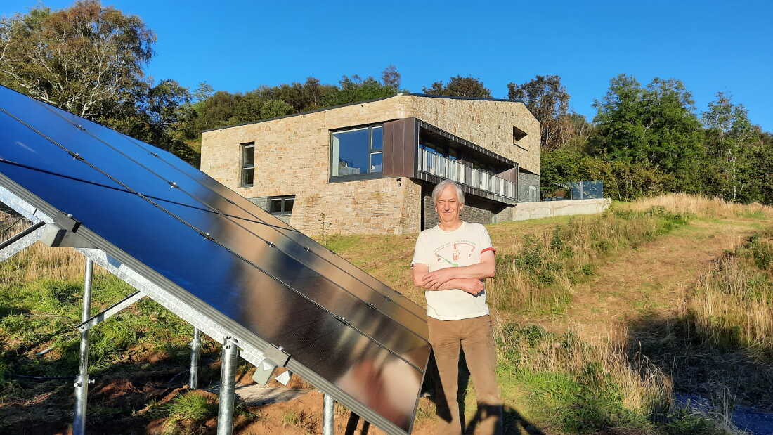 Mike Coe outside his “Passivhaus” on the Isle of Skye in Scotland, which he built with his partner Lizzie after deciding to move north for cooler summers.