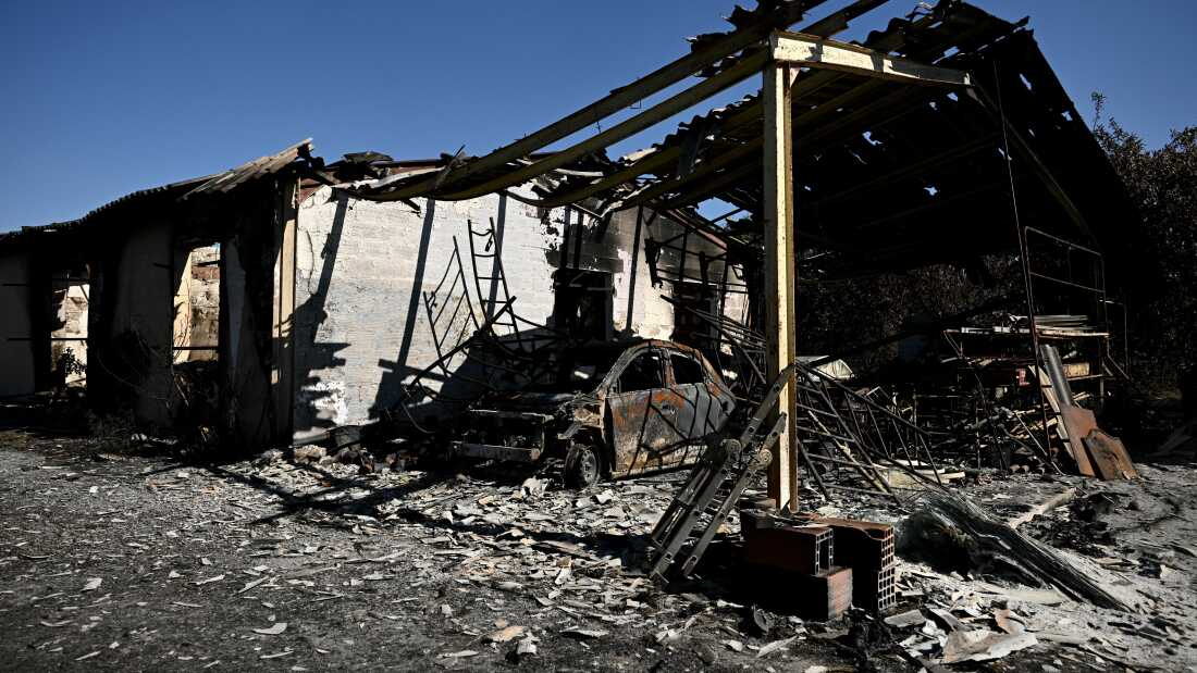 TOPSHOT - This photograph shows the building of a painting company destroyed by a wildfire in a business park in Biscarrosse, southwestern France on July 28, 2026. The fire that broke out on July 23, 2026, near Biscarrosse in the Landes region of southwestern France has been "contained," France's President announced on July 27. The Landes de Gascogne forest, home to maritime pines and a vital "lung" for the timber industry, has seen 42,000 hectares burn near Bordeaux. Forests are catching fire all the more easily because European vegetation and soils have been very dry for monthsa drought exacerbated by climate change and recent exceptional heatwaves. (Photo by Philippe Lopez / AFP via Getty Images)