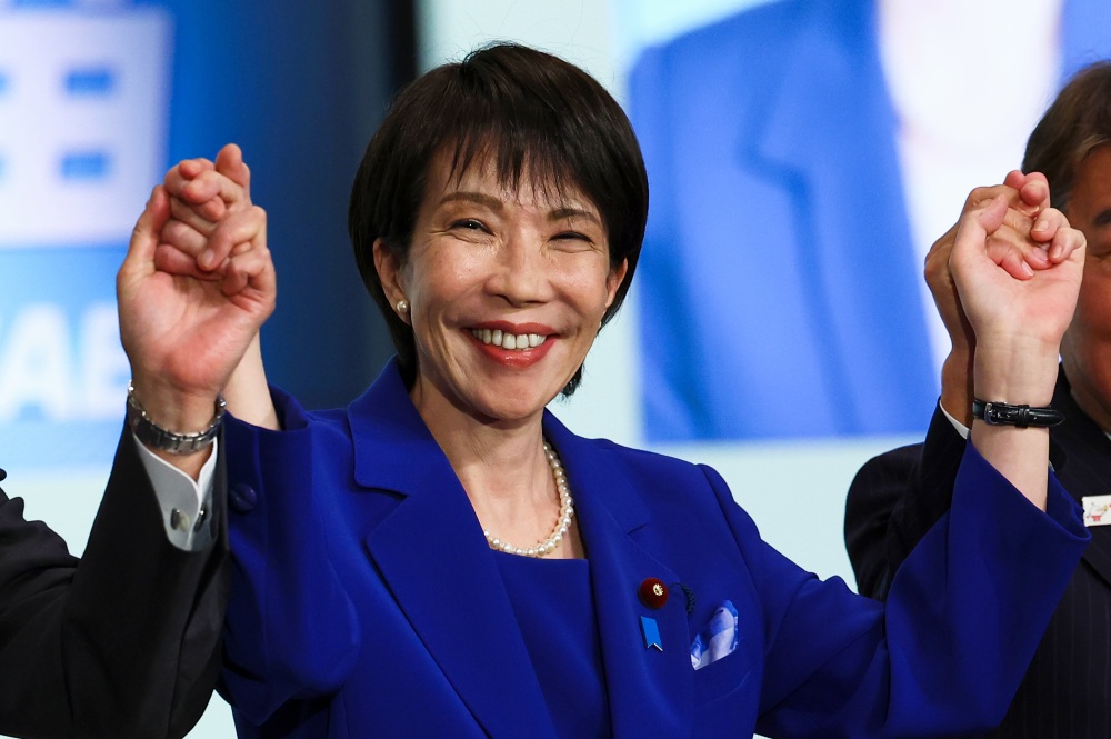 Newly-elected leader of Japan's Liberal Democratic Party (LDP) Sanae Takaichi celebrates after winning the LDP leadership election in Tokyo, Japan, on Saturday. (Pool Reuters)