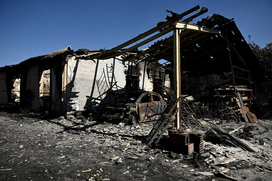 This photograph shows the building of a painting company destroyed by a wildfire in a business park in Biscarrosse, southwestern France on July 28, 2026.
