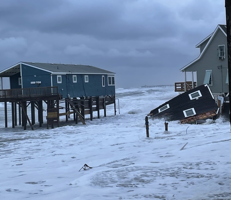 A portion of a house that collapsed during the overnight hours of Thursday and Friday is seen in the water in Rodanthe, N.C.