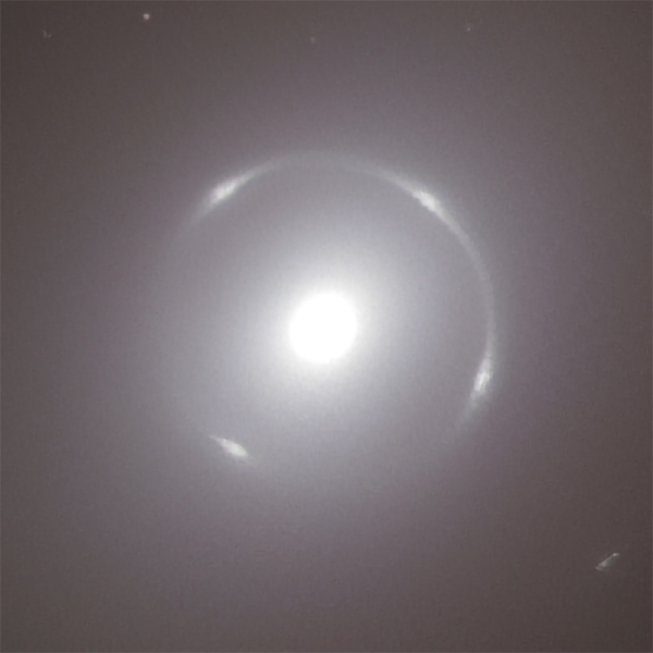 A close up of the center of galaxy NGC 6505 with the Einstein Ring around it.