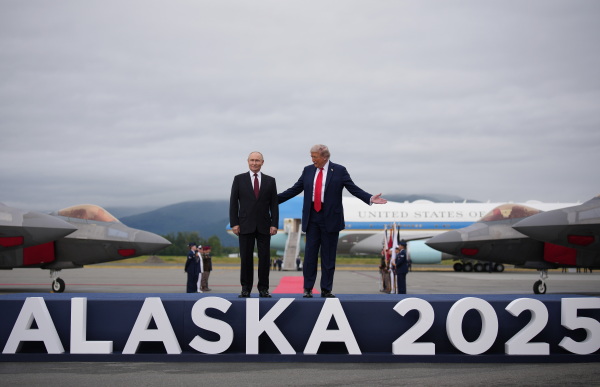 President Trump greets Russian President Vladimir Putin as he arrives at Joint Base Elmendorf-Richardson on Friday for talks aimed at ending the war in Ukraine.