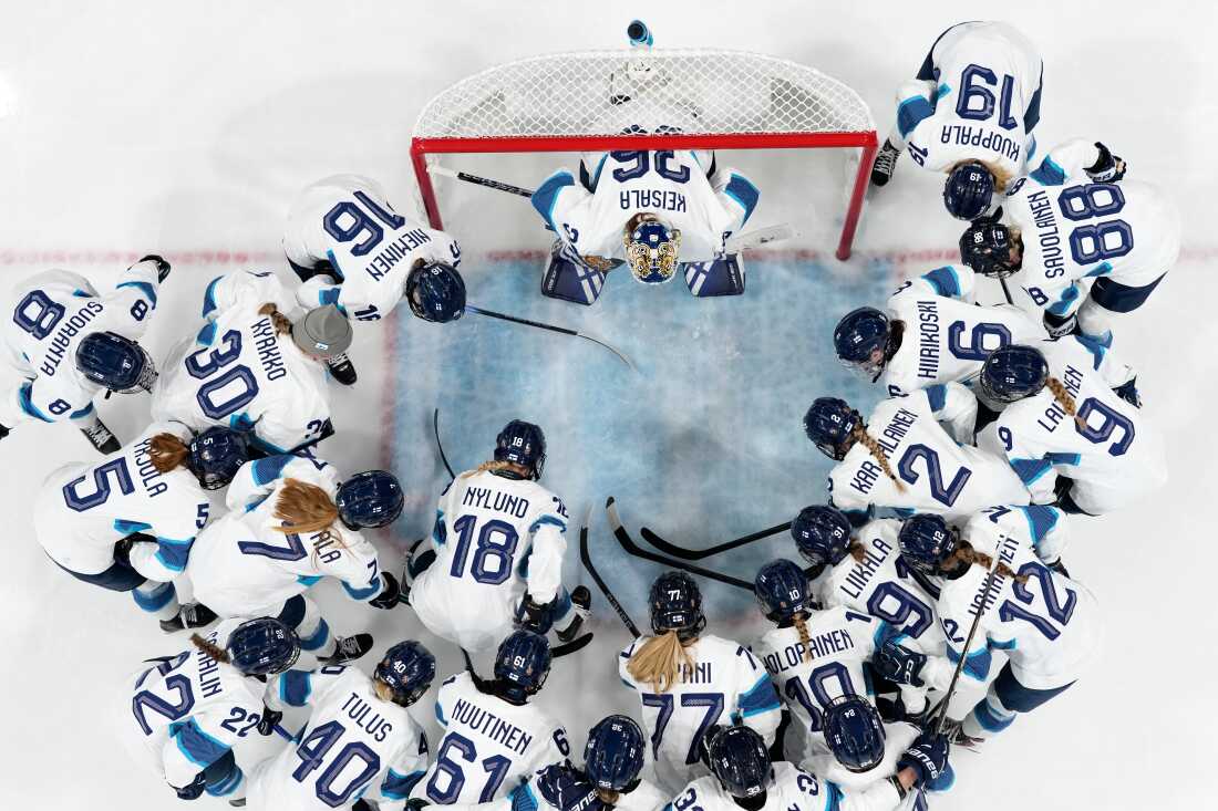 Team Finland huddle before a preliminary round match of women's ice hockey between Czechia and Finland at the 2026 Winter Olympics, in Milan, Italy, Sunday, Feb. 8, 2026. (AP Photo/Darko Bandic)