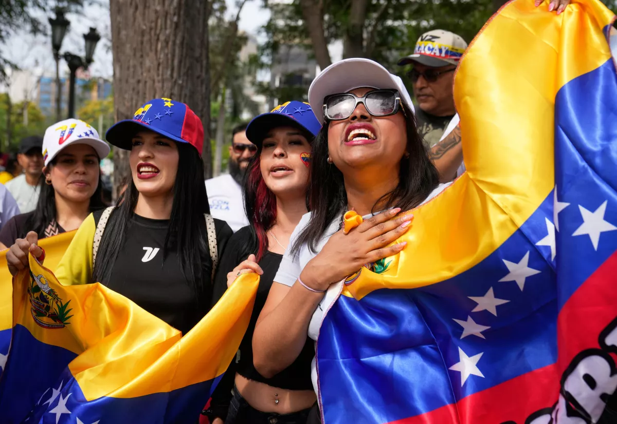 Venezuelans celebrate after President  Trump announced that President Nicolas Maduro had been captured and flown out of Venezuela, in Lima, Peru.