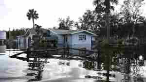 Floodwaters surround a home in the aftermath of Hurricane Helene on Friday in Crystal River, Fla.