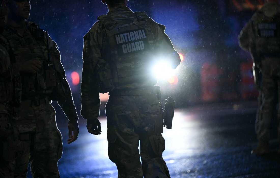 Members of the National Guard stand near the White House after a gunman opened fire in Washington, DC, on May 23, 2026.