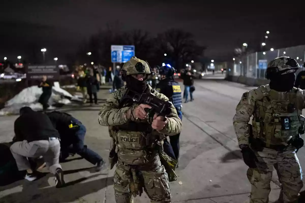 Federal immigration officers detain a protester outside Bishop Henry Whipple Federal Building, Jan. 15, 2026, in Minneapolis.