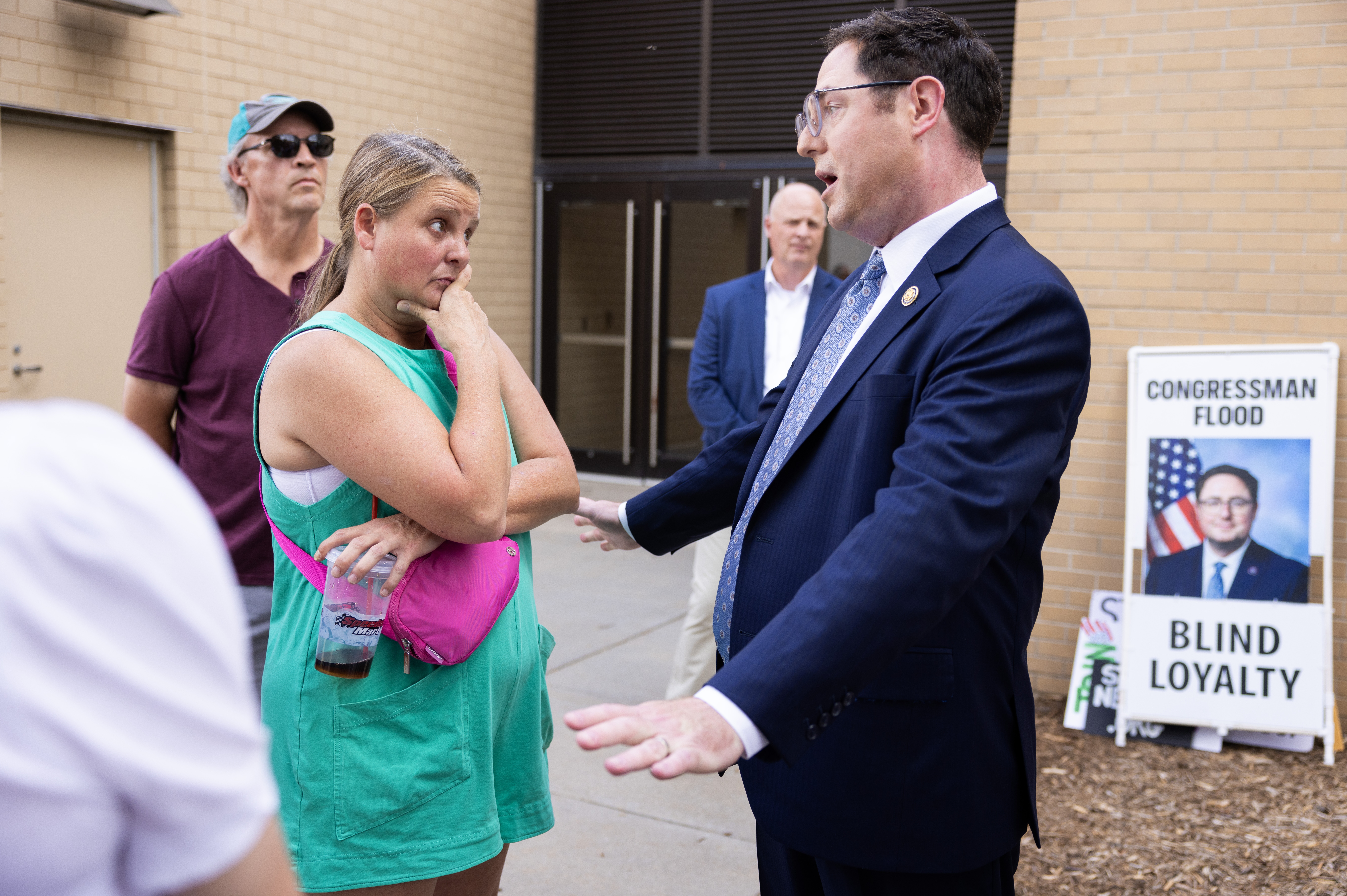Karen Wagner speaks with Rep. Mike Flood before a town hall at Kimball Recital Hall on the campus of the University of Nebraska-Lincoln in Lincoln, Neb., on Aug. 4.