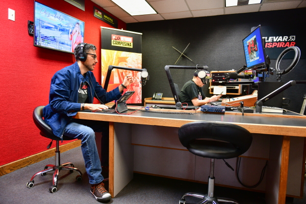 Osvaldo Franko and Jorge Alarcón finish up their show in the station’s headquarters on October 9, 2024 in Phoenix, Arizona.