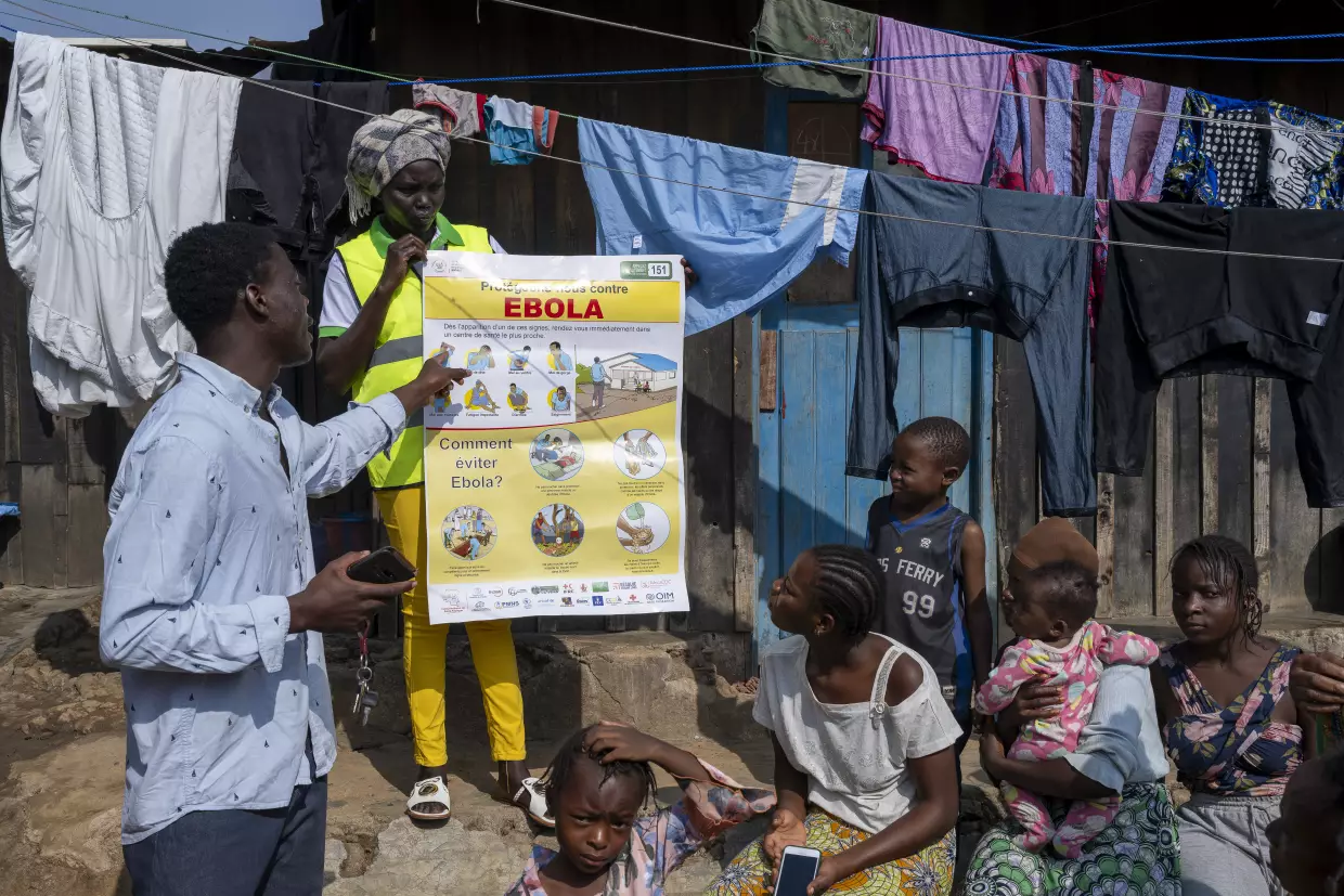 Eliezer Kasongo, president of REMEDE Bunia, raises awareness among residents about Ebola prevention measures during a community outreach event on Ebola Awareness Day in Bunia, Ituri Province, Democratic Republic of the Congo.