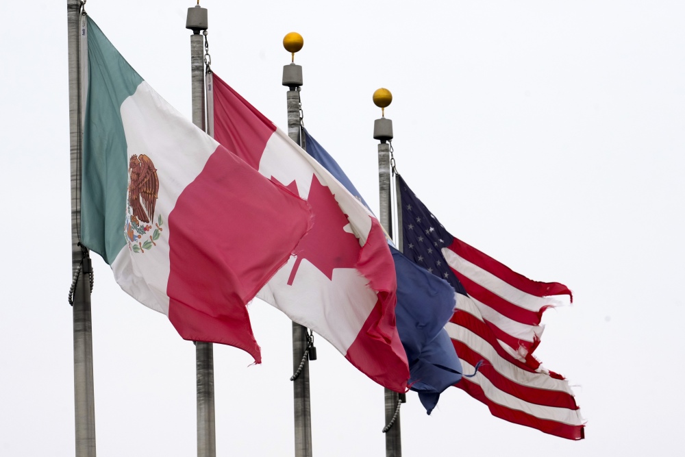 The flags of Mexico, Canada and the United States are shown near the Ambassador Bridge, Monday, Feb. 3, 2025, in Detroit. (AP)