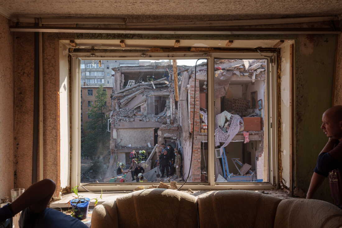 Locals and rescuers clear the rubble of a residential building destroyed in a Russian missile strike on Pryluky, Ukraine, Wednesday, Oct. 7, 2026.